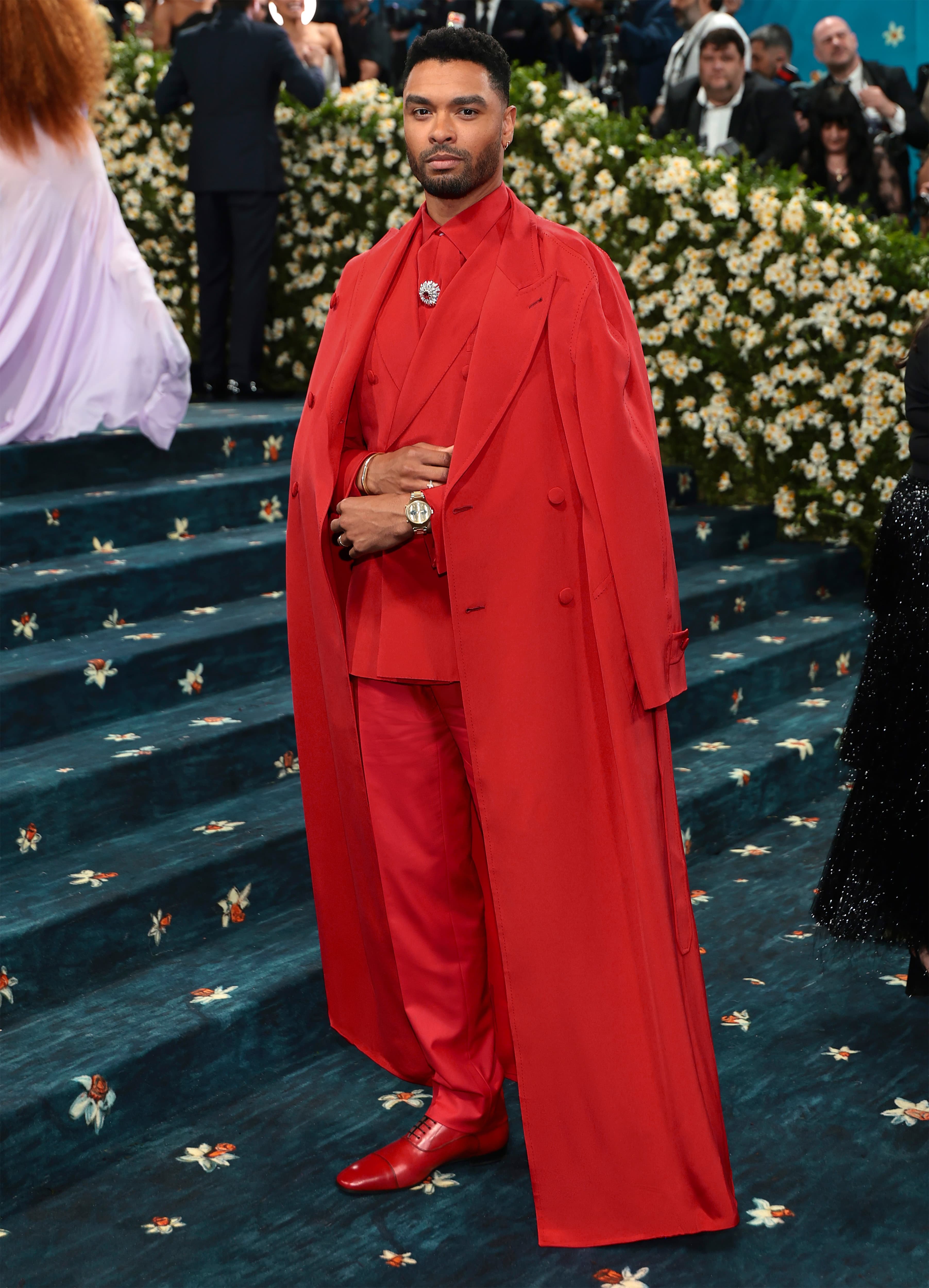 Regé-Jean in striking all-red Brioni Suit with long coat at Met Gala.