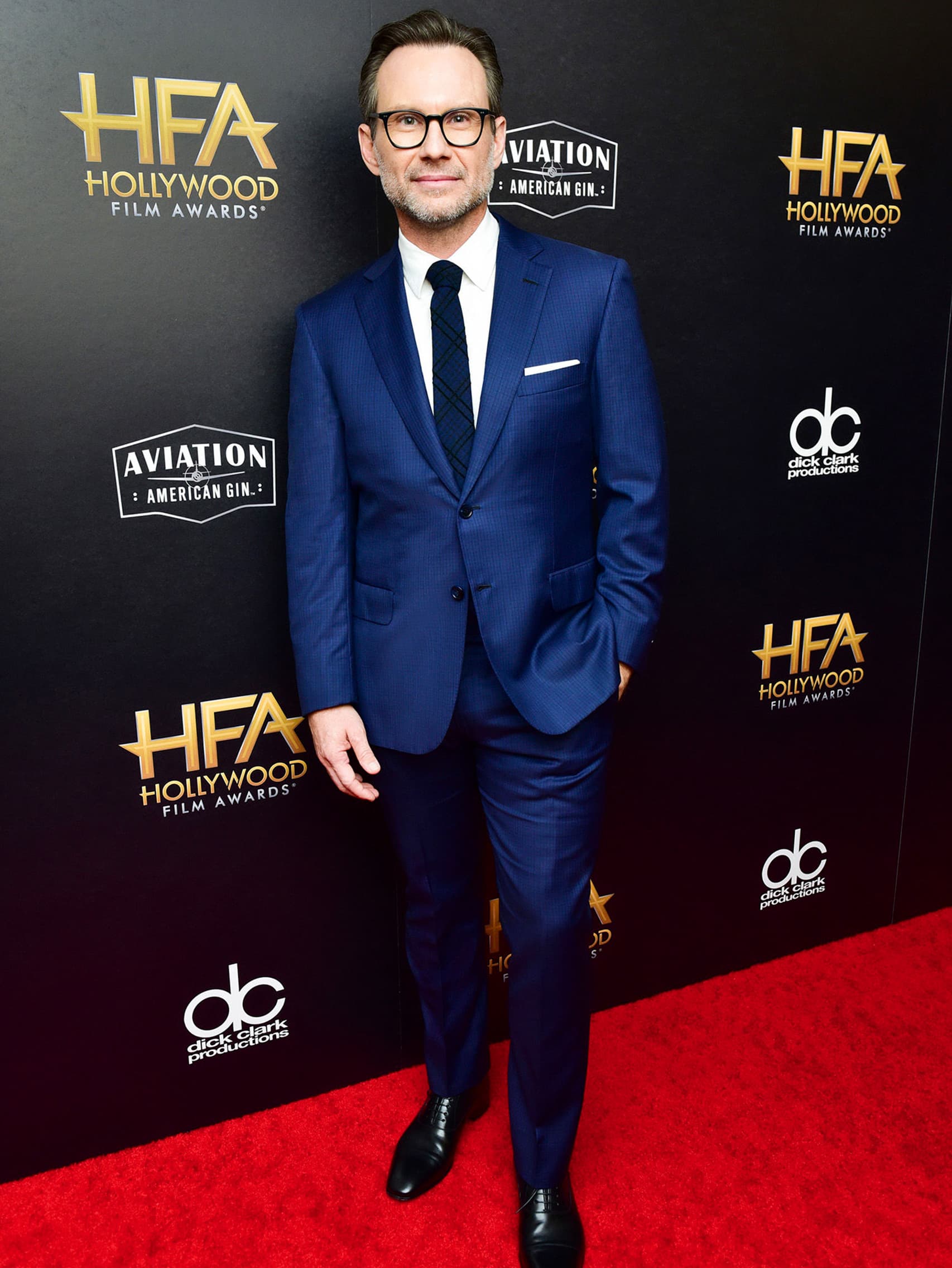 Christian Slater wearing a Brioni bespoke blue suit